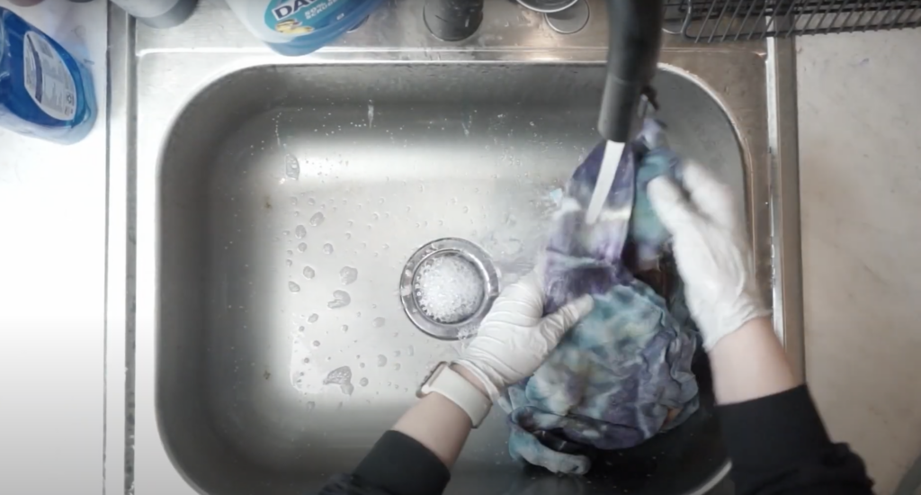 rinsing out a hoodie